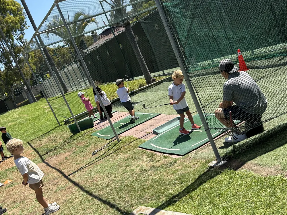Young golfers practicing their swings