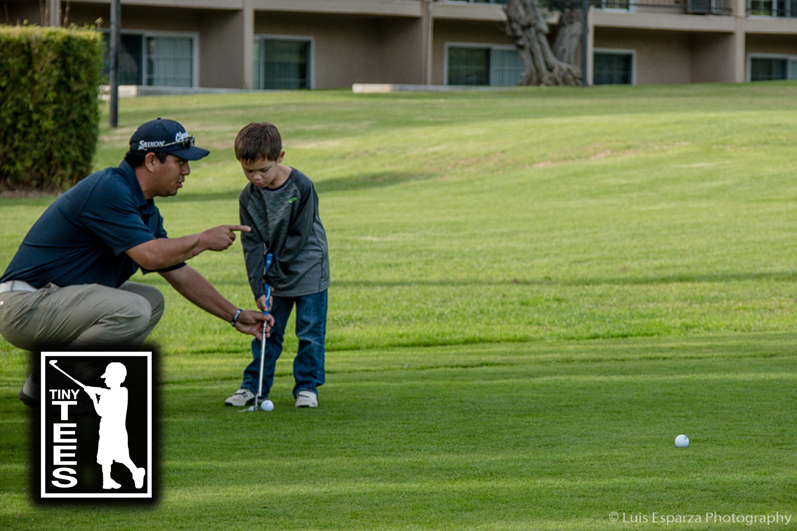 Coach Trapper Perkins guiding a young player's putting stance.